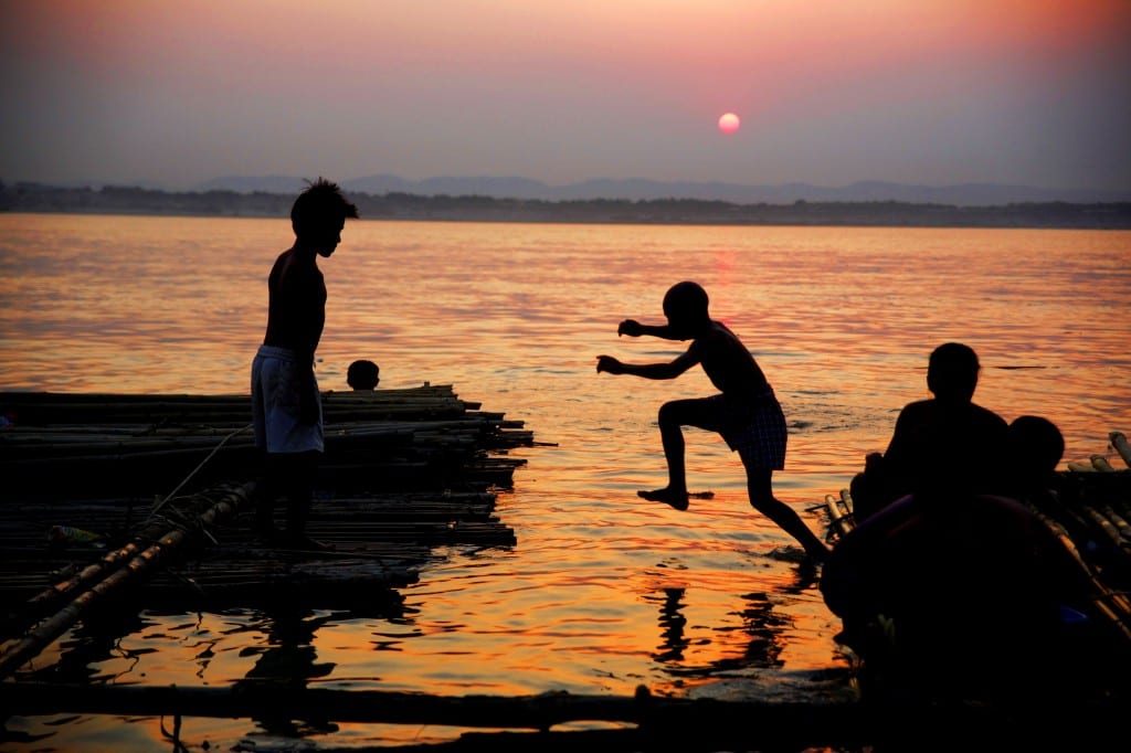 bathing at sunset Burma 