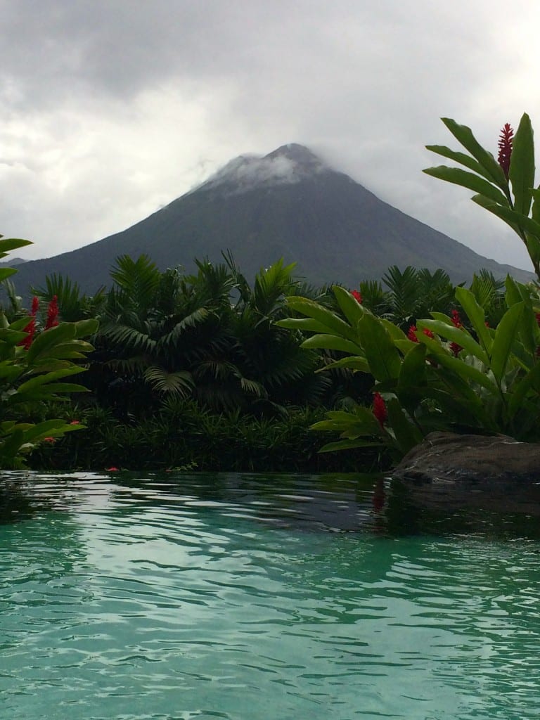 The top of Arenal pokes through the rain clouds Costa Rica