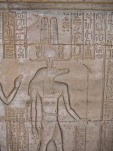 The god Sobek surrounded by hieroglyphic messaging